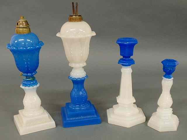 Appraisal: Two blue and white Sandwich glass fluid lamps tallest h