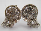 Appraisal: A pair of white metal tests carat gold diamond earrings