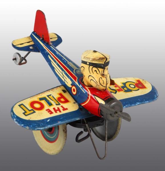 Appraisal: Tin Marx Popeye the Pilot Wind-Up Toy Description American Working