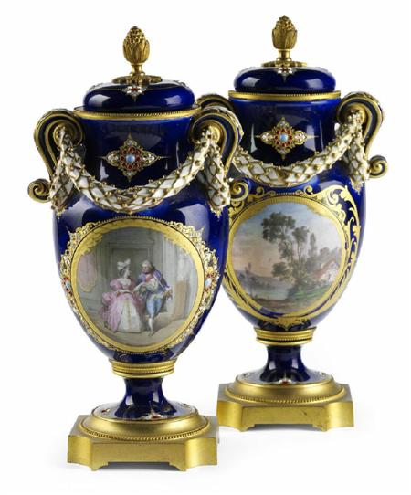 Appraisal: A pair of th century Sevr s style vases and