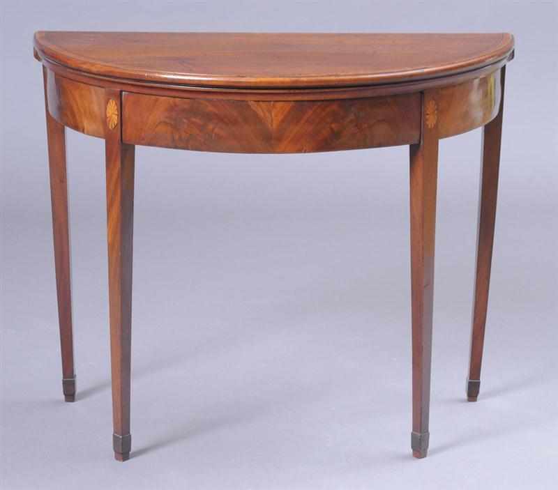 Appraisal: GEORGE III INLAID MAHOGANY D-SHAPED GAMES TABLE The folding cross-banded