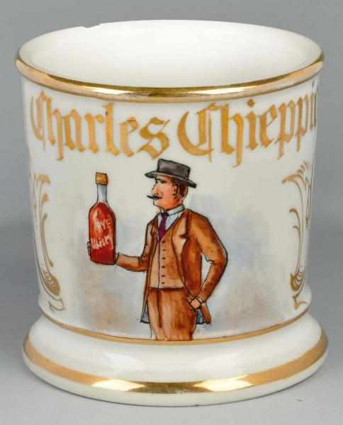 Appraisal: Man Holding Bottle of Rye Whiskey Shaving Mug Description Gilt