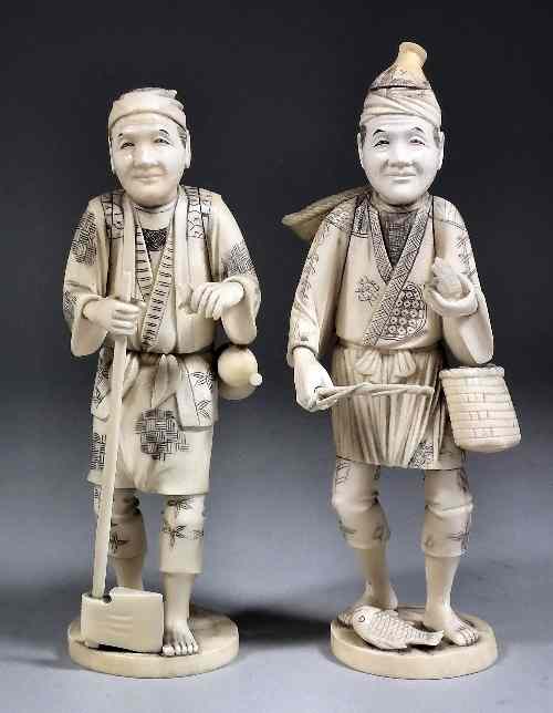 Appraisal: A pair of Japanese carved ivory okimono each in the