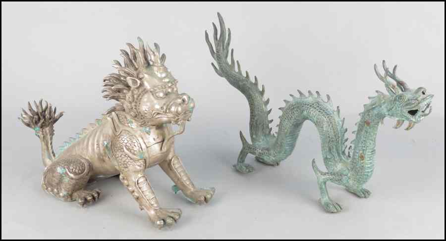 Appraisal: PATINATED METAL FOO DOG Together with a patinated metal dragon