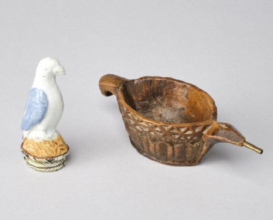 Appraisal: A small glazed earthenware bird model together with an antique