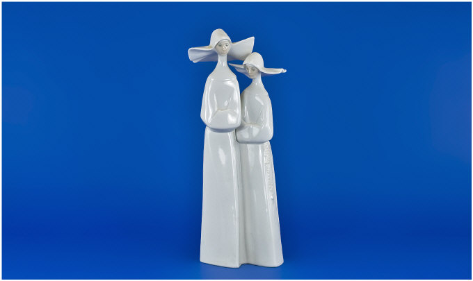 Appraisal: Lladro Figure Two white nuns No Issued Designer Fulgencio Garcia