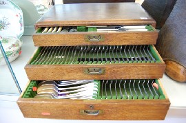 Appraisal: EARLY TH OAK THREE DRAWER CANTEEN OF EP FLATWARE KNIVES