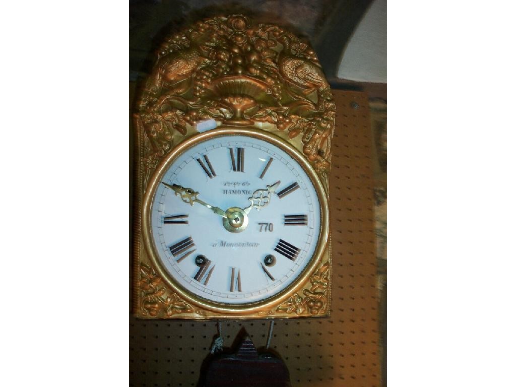 Appraisal: A th century wall clock with embossed brass surround enamelled