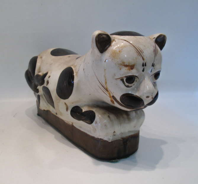 Appraisal: CHINESE CIZHOU STYLE POTTERY CAT PILLOW depicting a spotted cat