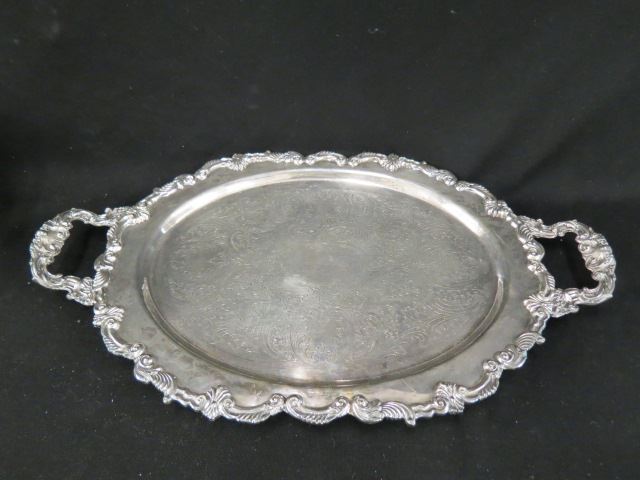 Appraisal: Silverplate Oval Serving Tray footed elaborate designs x plus handles