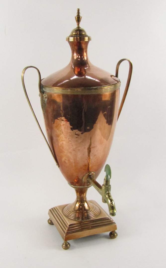 Appraisal: A George III copper and brass tea urn of twin