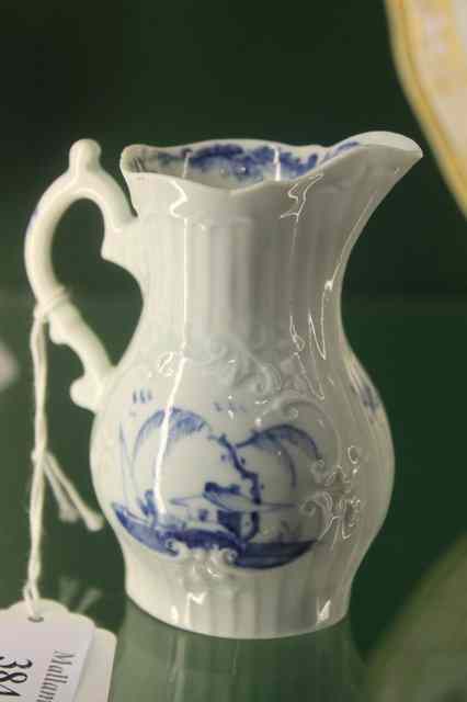 Appraisal: A WORCESTER RELIEF MOULDED SMALL CREAM JUG with under glazed