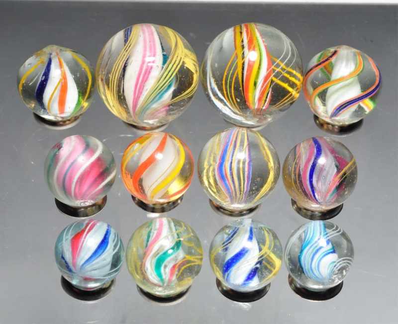 Appraisal: Lot of Various Swirl Marbles Description Includes three divided core