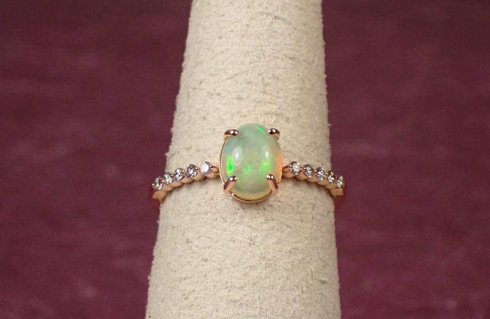 Appraisal: OPAL DIAMOND AND FOURTEEN KARAT GOLD RING The rose gold