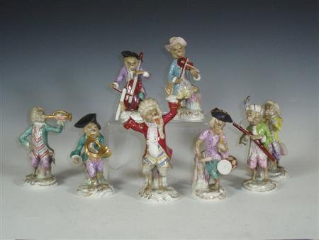 Appraisal: A German porcelain part monkey band each decorated in polychrome