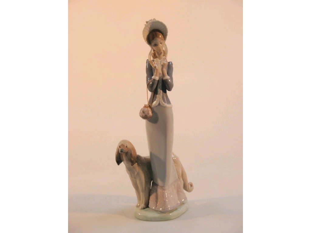 Appraisal: A Lladro figure group of an elegant young lady and