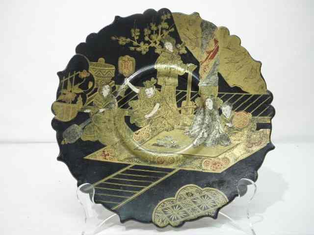 Appraisal: Chinoiserie black lacquer plate Gilt painted scene on front depicts