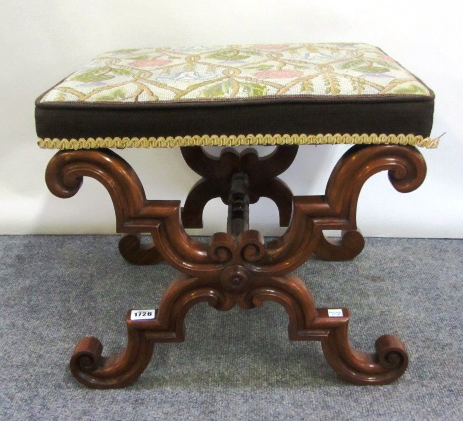 Appraisal: A Victorian rosewood framed footstool on shaped 'X' frame supports