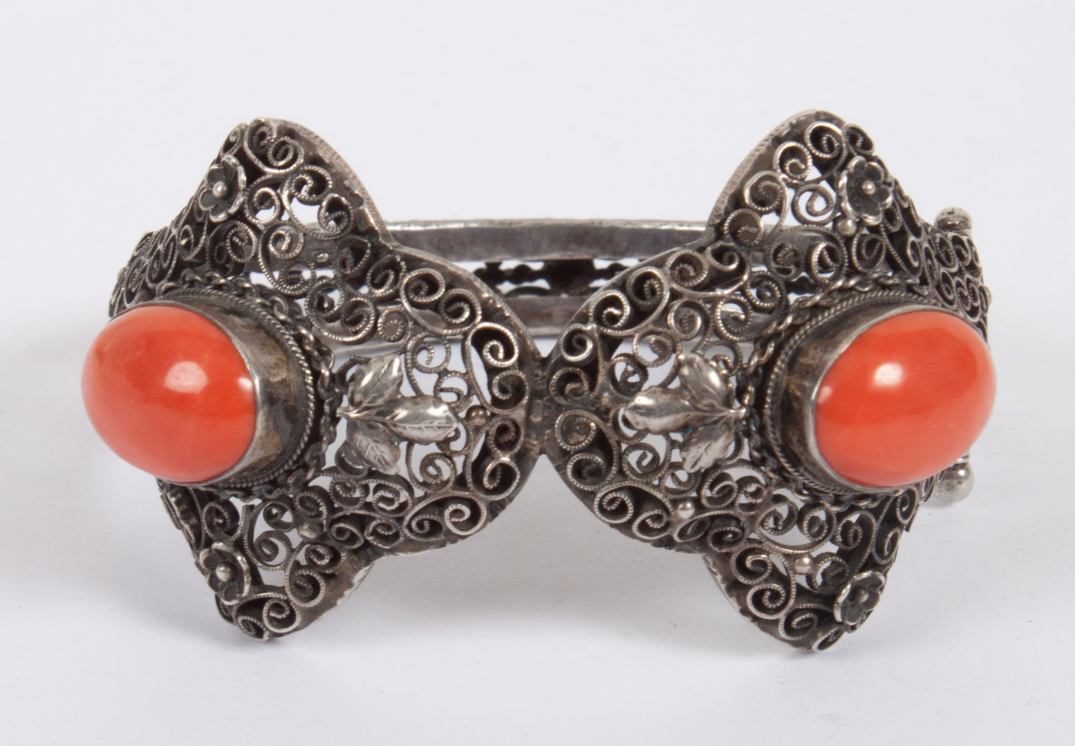 Appraisal: Italian arabesque silver filigree bangle bracelet presenting coral cabochons the