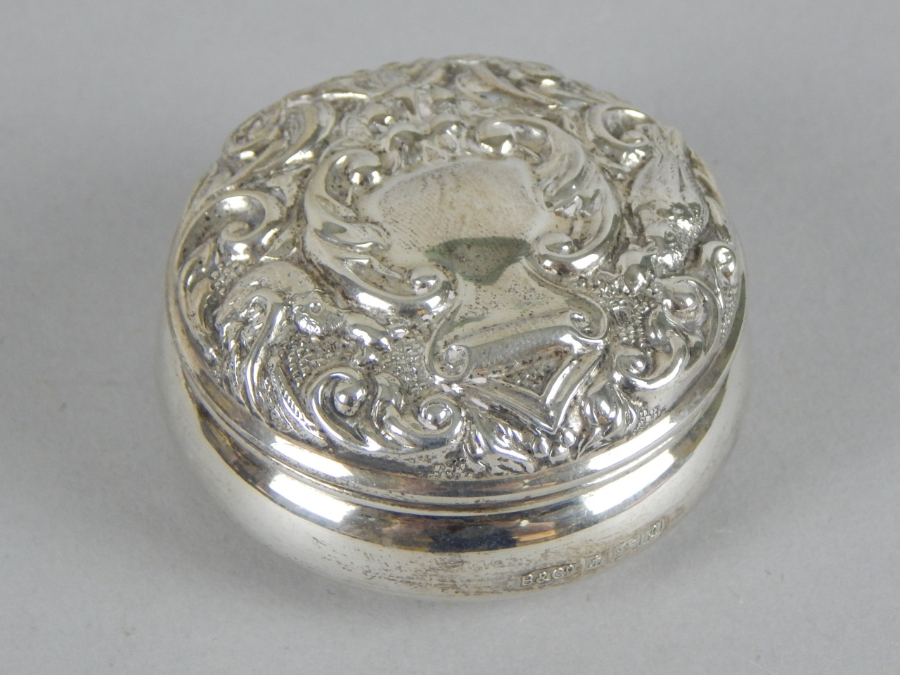 Appraisal: A modern embossed silver circular box and cover cm diameter