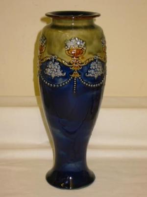 Appraisal: A ROYAL DOULTON STONEWARE VASE of slender inverted baluster form