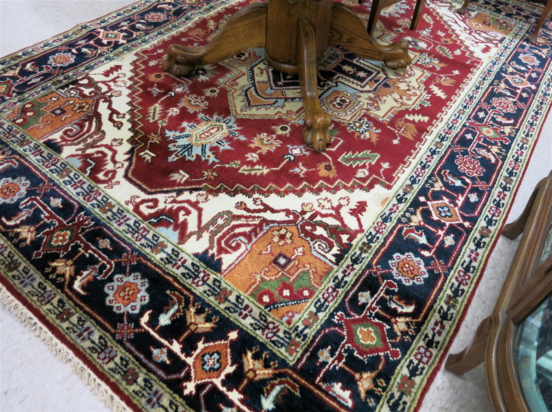 Appraisal: HAND KNOTTED ORIENTAL CARPET Persian Serapi design the geometric medallion