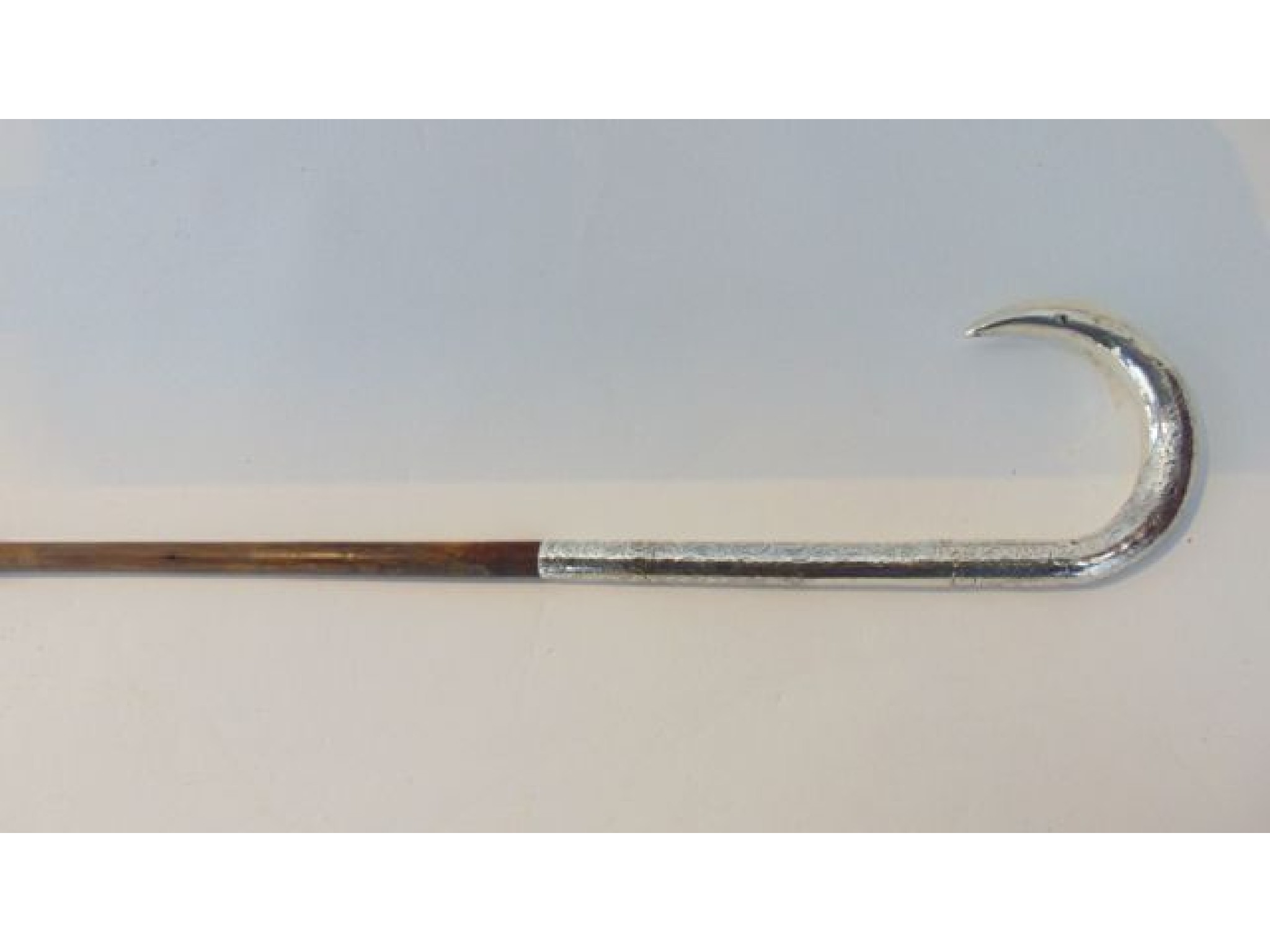 Appraisal: A slender bamboo walking cane terminating in an extensive silver