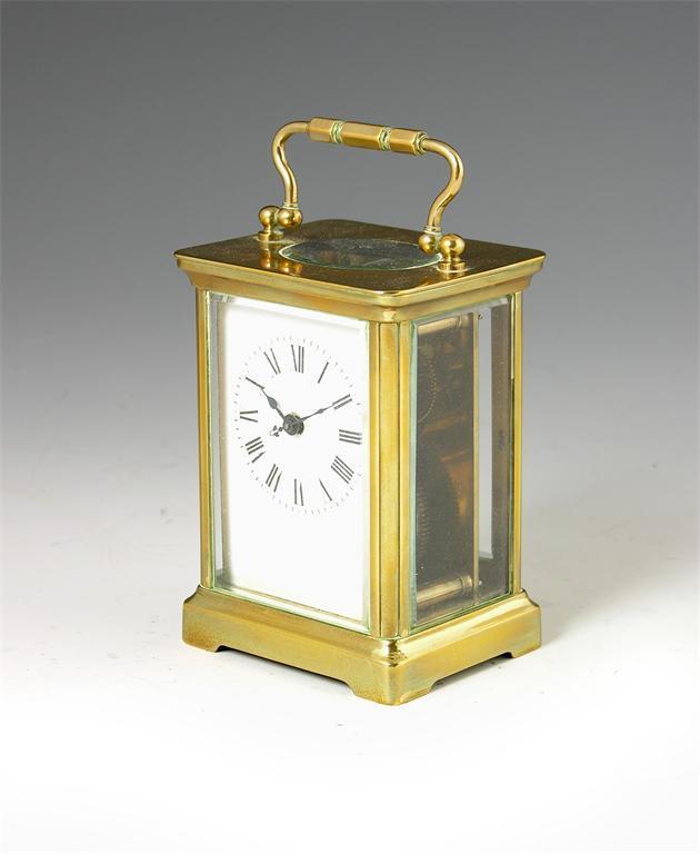 Appraisal: A corniche cased gilt brass carriage timepiece