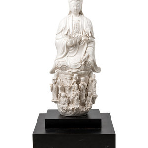 Appraisal: A Chinese White Glazed Porcelain Figure of Guanyin th Century