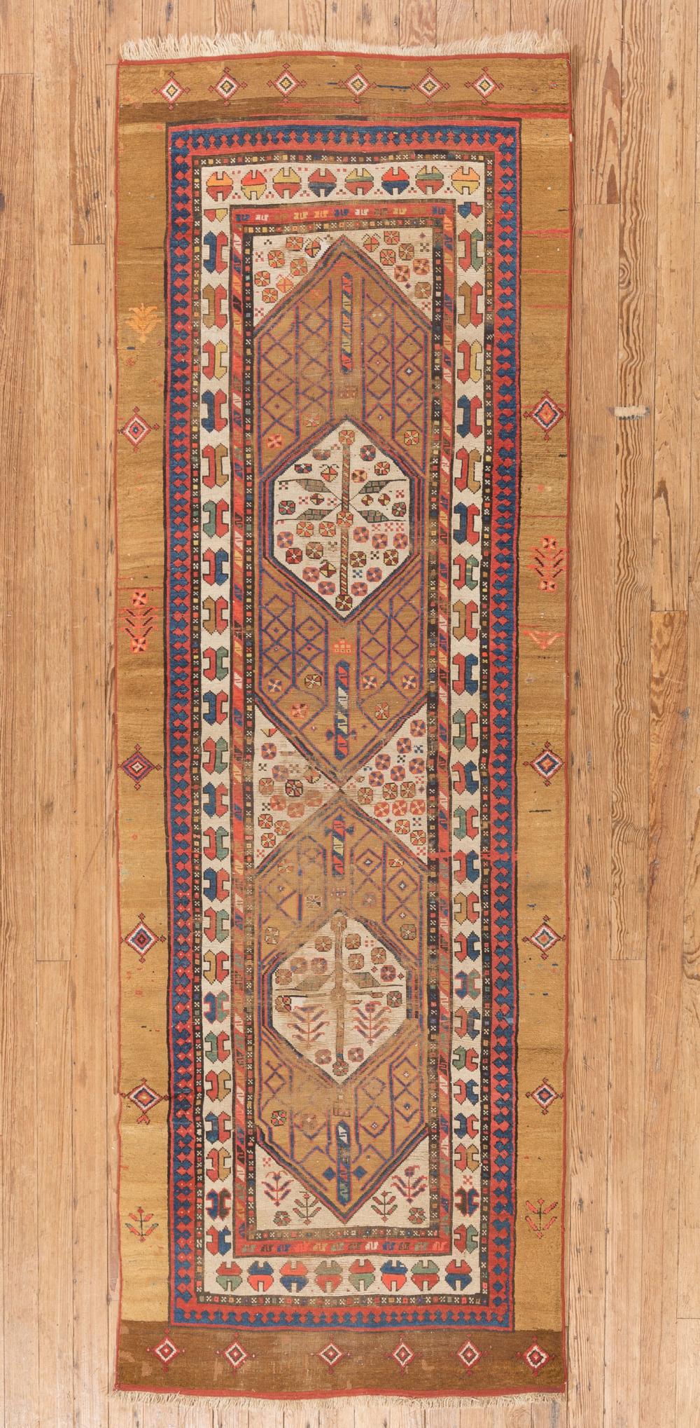 Appraisal: Antique Caucasian Runner double central medallions repeating design inner borders