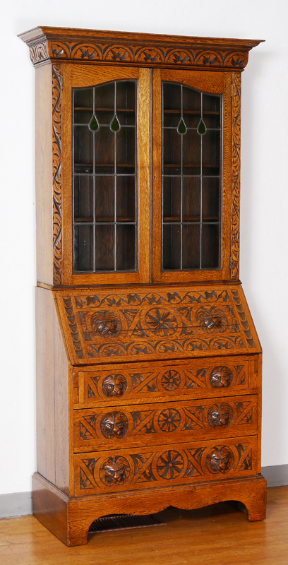 Appraisal: CARVED OAK SECRETARY BOOKCASE Circa late th century chip carved