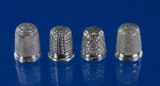 Appraisal: Collection of Four Silver Thimbles A pair by Henry Griffiths