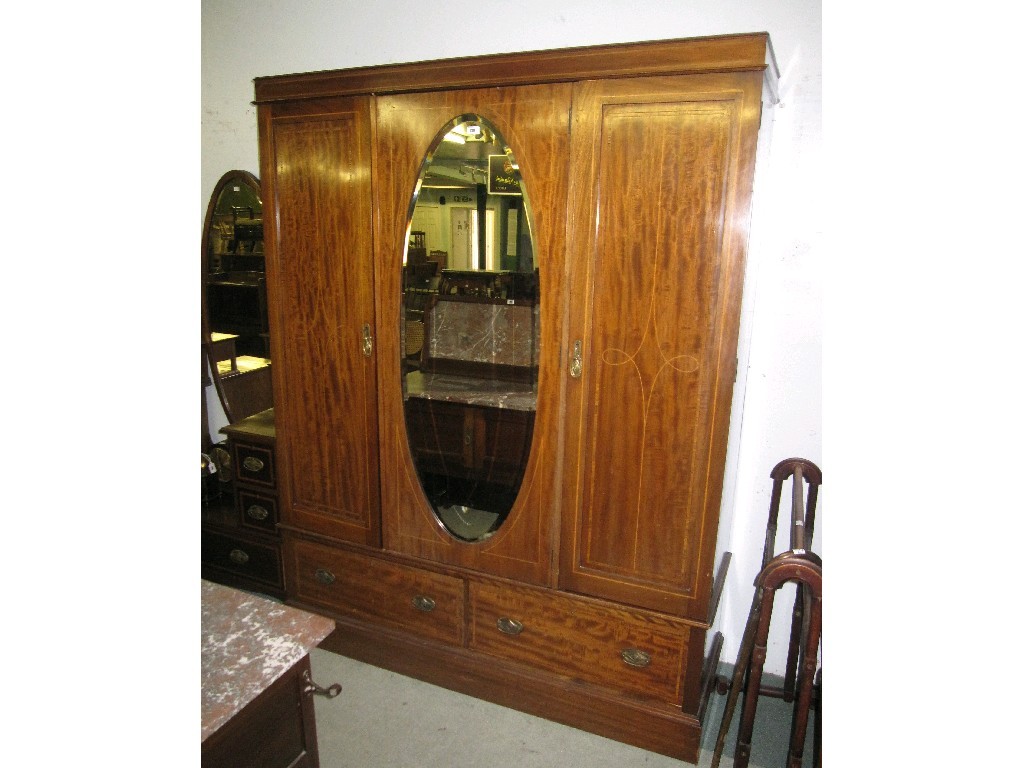 Appraisal: Edwardian mahogany three section mirror door wardrobe with matching dressing