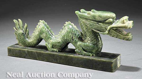 Appraisal: A Chinese Carved Serpentine or Spinach Green Jade Serpent Dragon