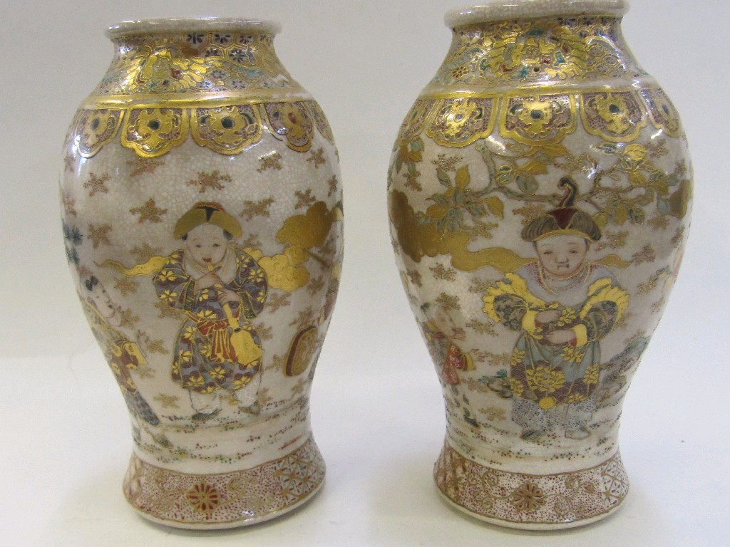 Appraisal: Pair of Satsuma vases each decorated with children playing in