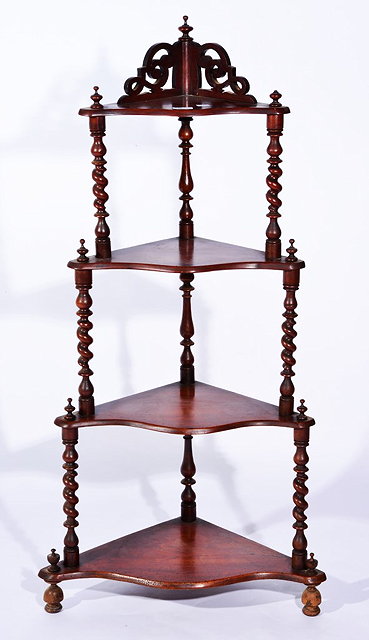 Appraisal: A TH CENTURY MAHOGANY WHATNOT with four graduated shelves with