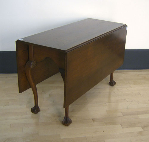 Appraisal: Chippendale style walnut dining table h x w x l