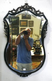 Appraisal: A carved oak shaped wall mirror cm high cm wide