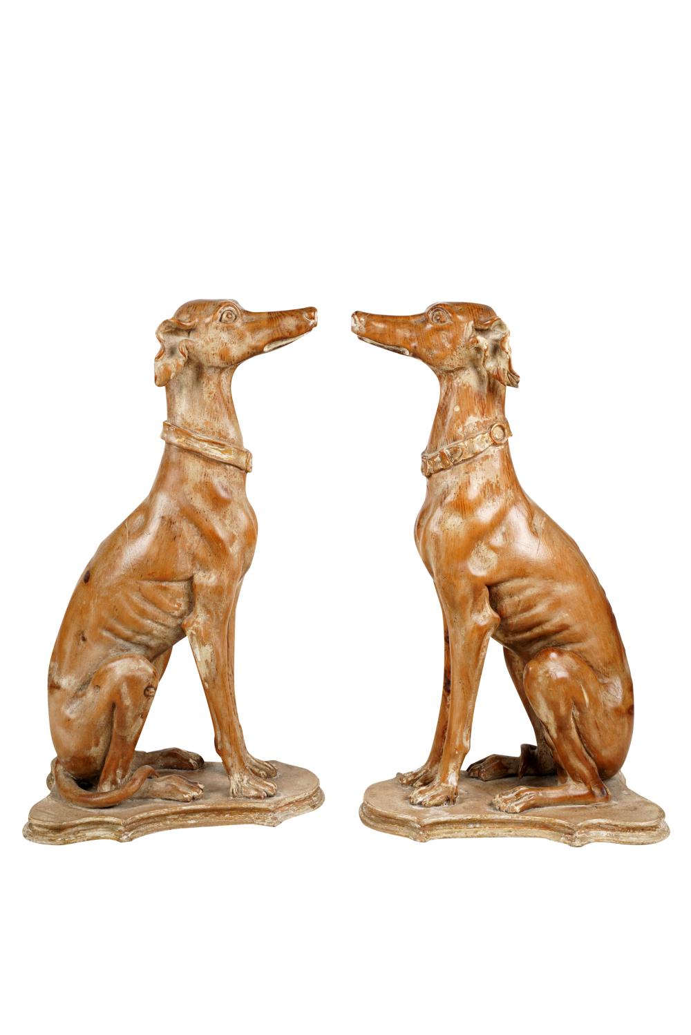 Appraisal: PAIR OF ITALIAN CARVED WOOD GREYHOUNDSeach seated on a cartouche