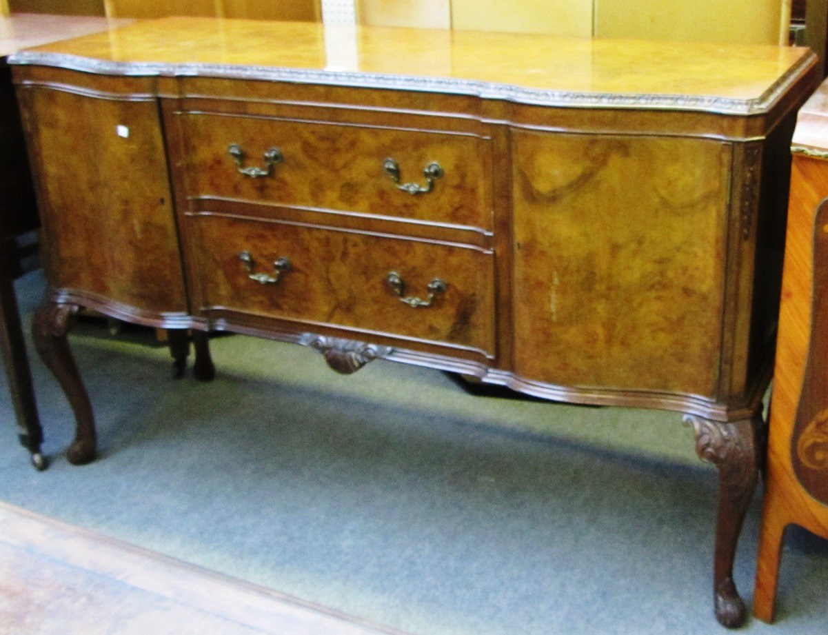 Appraisal: A mid th century figured walnut sideboard of early th