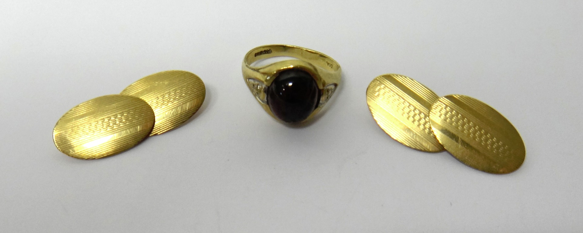 Appraisal: A pair of ct gold oval cufflinks with engine turned