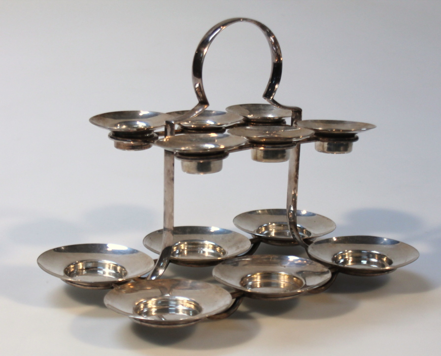 Appraisal: An Edwardian silver plated condiment dish the upper section set