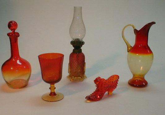 Appraisal: Amberina shaded red to orange items small oil lamp jug