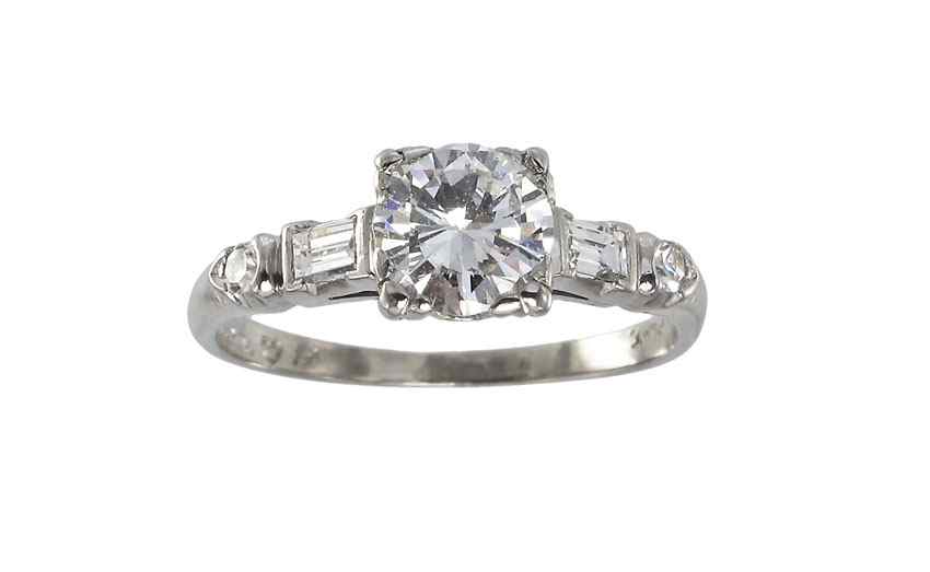 Appraisal: PLATINUM DIAMOND ENGAGEMENT RING Platinum ring centers a round brilliant