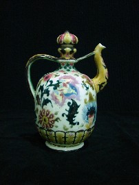 Appraisal: A Zsolnay Pecs rosewater urn and cover profusely decorated with