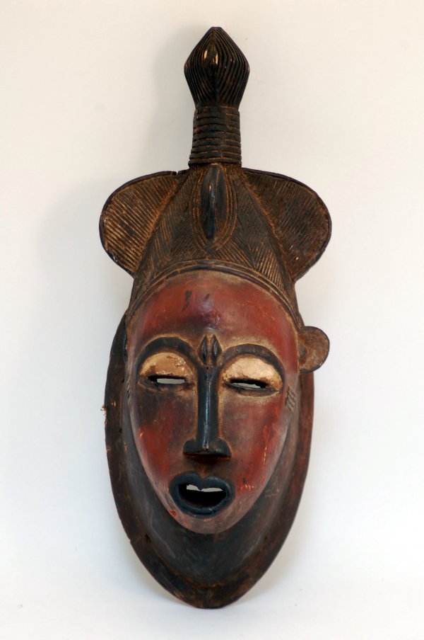 Appraisal: Baule carved wood mask with typical pointed chin T-shaped nose