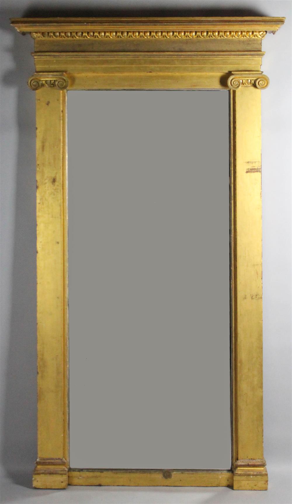 Appraisal: LARGE CLASSICAL CARVED AND GILT PIER MIRROR having a cornice