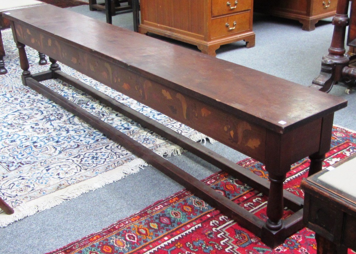 Appraisal: A Victorian mahogany rectangular bench with inlaid squirrel decoration on