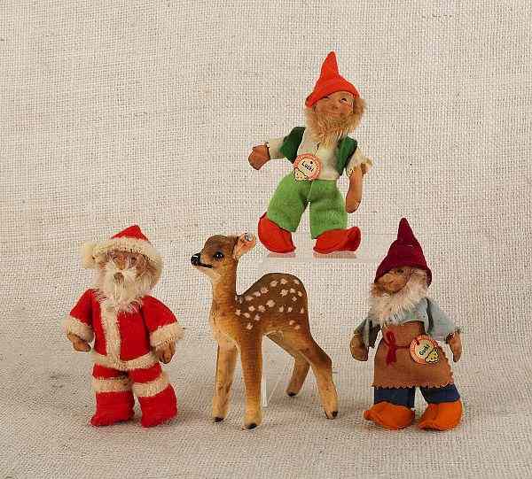 Appraisal: Four Stieff Christmas dolls together with a Japanese porcelain doll