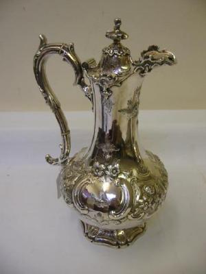 Appraisal: A VICTORIAN HOT WATER JUG of baluster form the domed